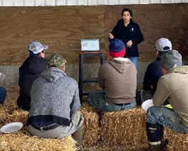 A dairy educator who is teaching participants.